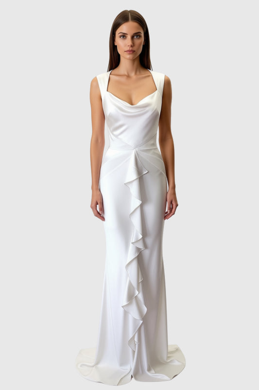 A woman modeling a silk satin bespoke bridal gown light ivory bridal gown with a draped cowl neckline, fitted silhouette, and cascading ruffle detail down the front. Bespoke bridal made in London.