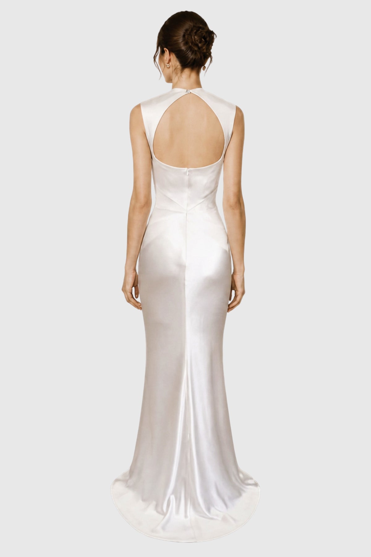 model wearing a silk satin bridal gown with a high open back and a slight train. Couture wedding dress.